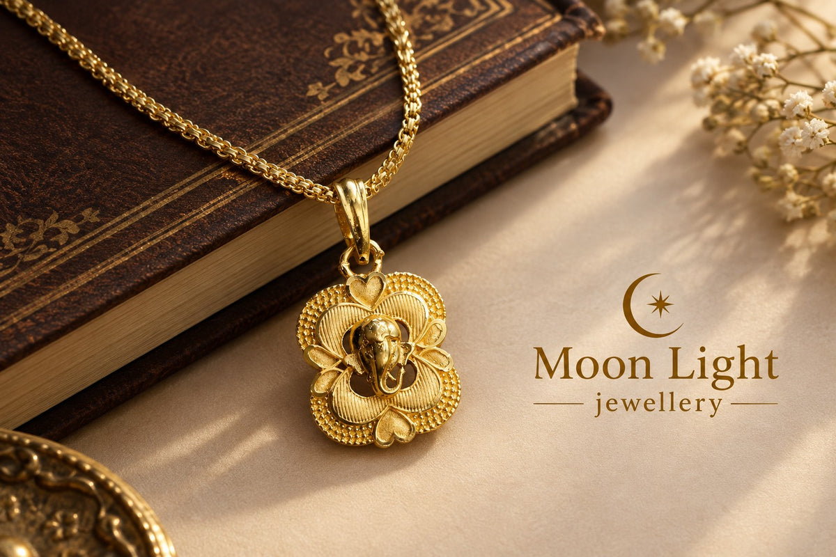 Moon Light Jewellery gold plated Ganesha pendant in an octagon frame with a matching chain on a vintage book.